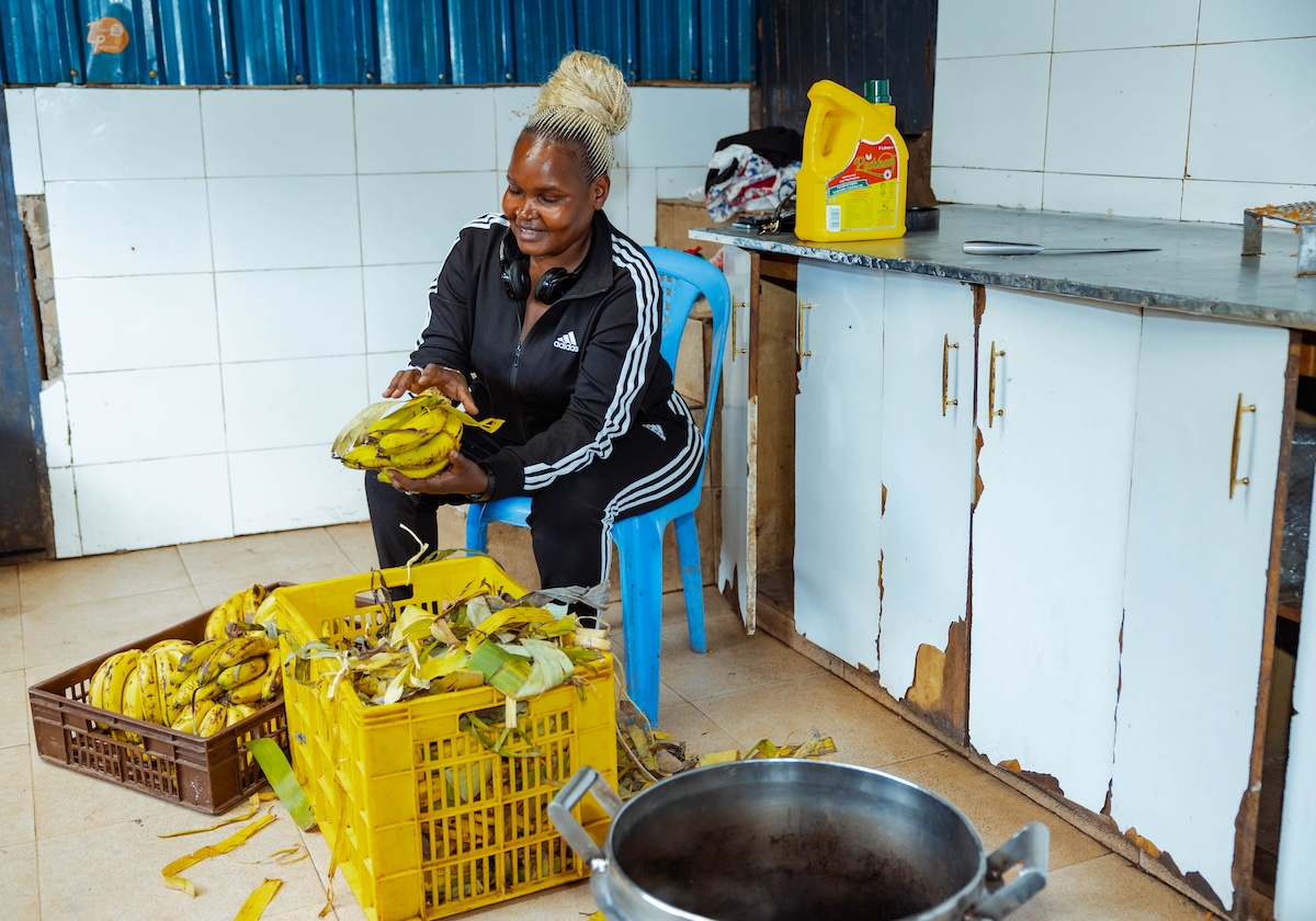 Preparing bananas for the children in the kitchen