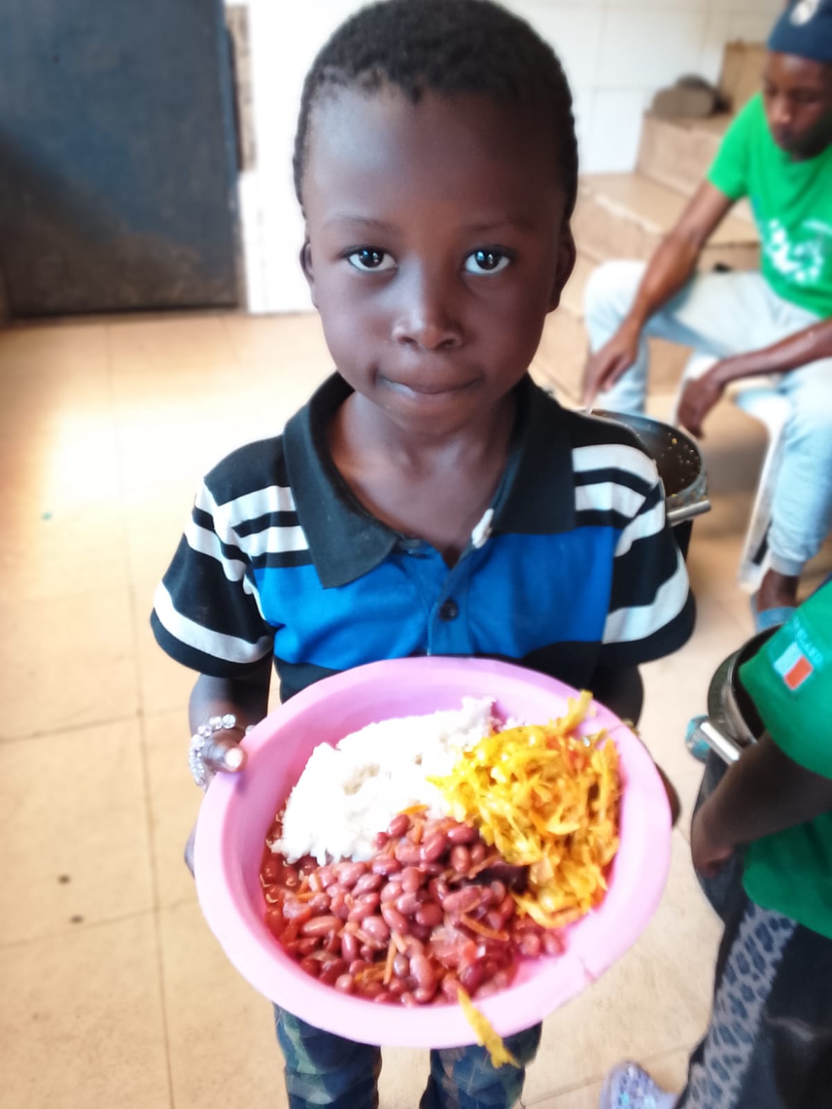 A child holding a freshly served plate